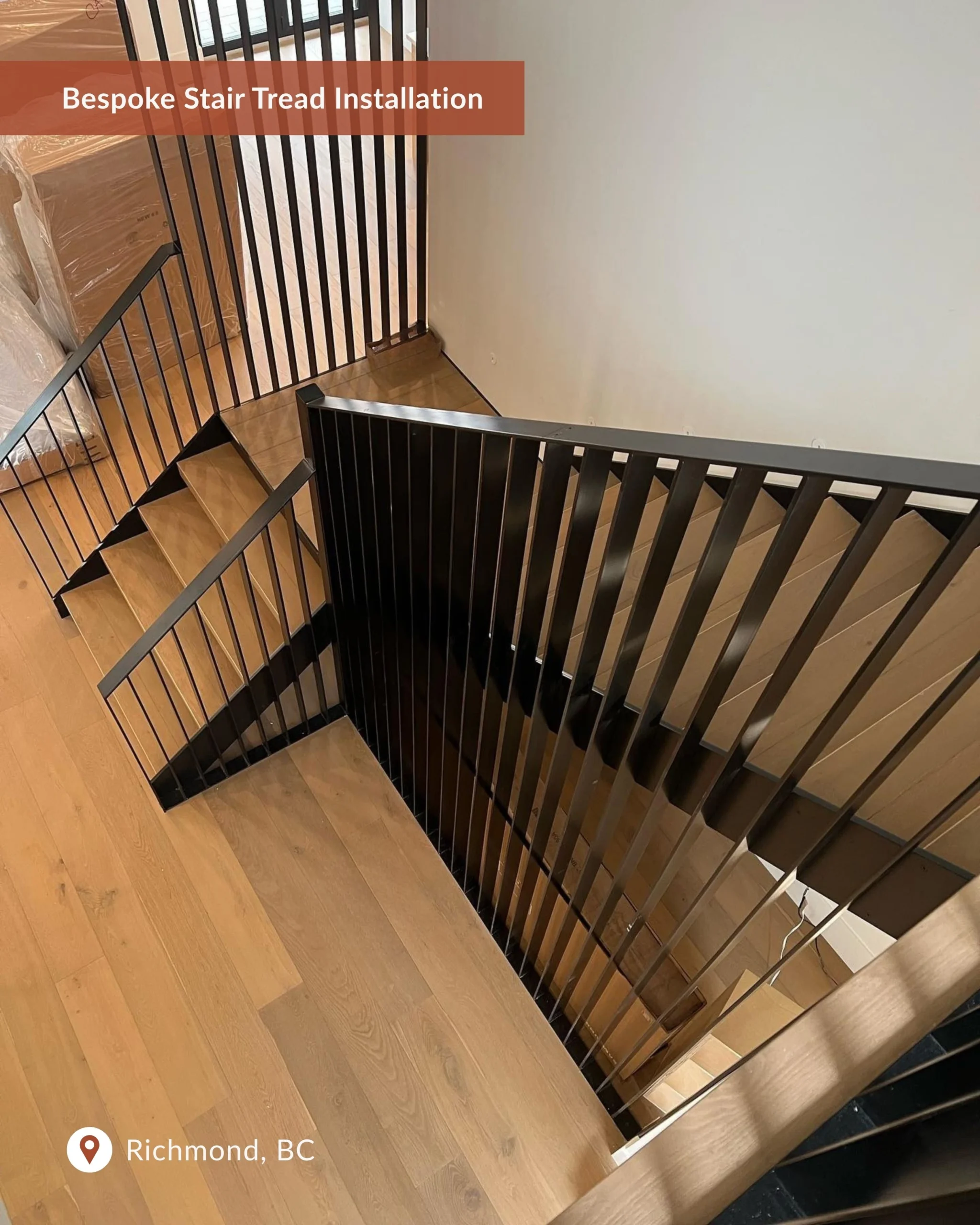 Finished custom stair tread installation in a modern residential space