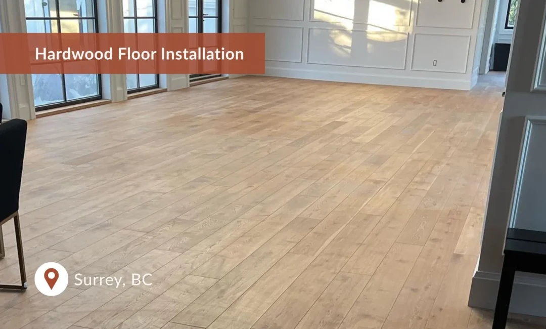 Hardwood floor installation completed in a bright, open living area